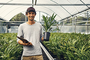 Farmer standing in greenhouse